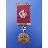 A boxed early 20thC 9ct gold Masonic medal by M.E. Mazzucchelli of Perth, Western Australia, for the
