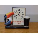 A late 20thC 'Guinness Time' Toucan battery table clock - working order, 8.5" high.