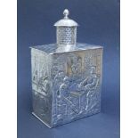 A Dutch silver tea caddy of rectangular plan, the sides embossed with rustic family groups, London