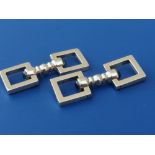 A boxed pair of Cartier New York sapphire set 14K gold cufflinks, formed as knopped batons with