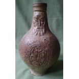 A 17thC bellarmine pottery jug of small proportions, 8.5" high.