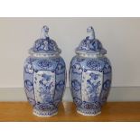 A large pair of late 19thC blue & white delft vases with covers, having chinoiserie decoration ,