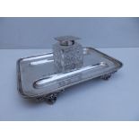 A late Victorian Elkington silver standish, of rectangular plan with square cut glass inkwell -