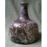 An antique glass bottle, 6.25" high.