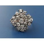 A late 20thC diamond cluster ring, the largest old cut stone measuring approximately 4mm diameter,