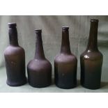 Four antique glass bottles, tallest 11.75".