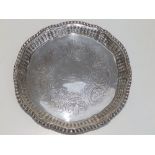 An early Victorian crested silver waiter with ozier pattern raised rim by George Frederick Pinnell