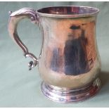 A George II silver tankard, of plain design with double-curve handle, Thomas Farren, London 1737, 5"