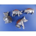 Three plated pin cushion pigs and a cat, the largest. 2" high. (4)