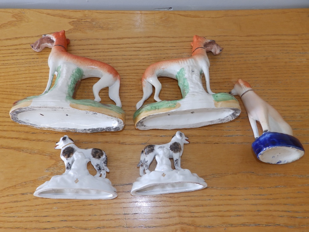 A pair of Victorian Staffordshire greyhounds with rabbits, 7.75" high and three other - Image 2 of 2