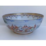 An 18thC Chinese porcelain punch bowl, finely painted with a continuous fox-hunting scene, 14.5"