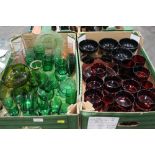 Two boxes of green and red glassware etc