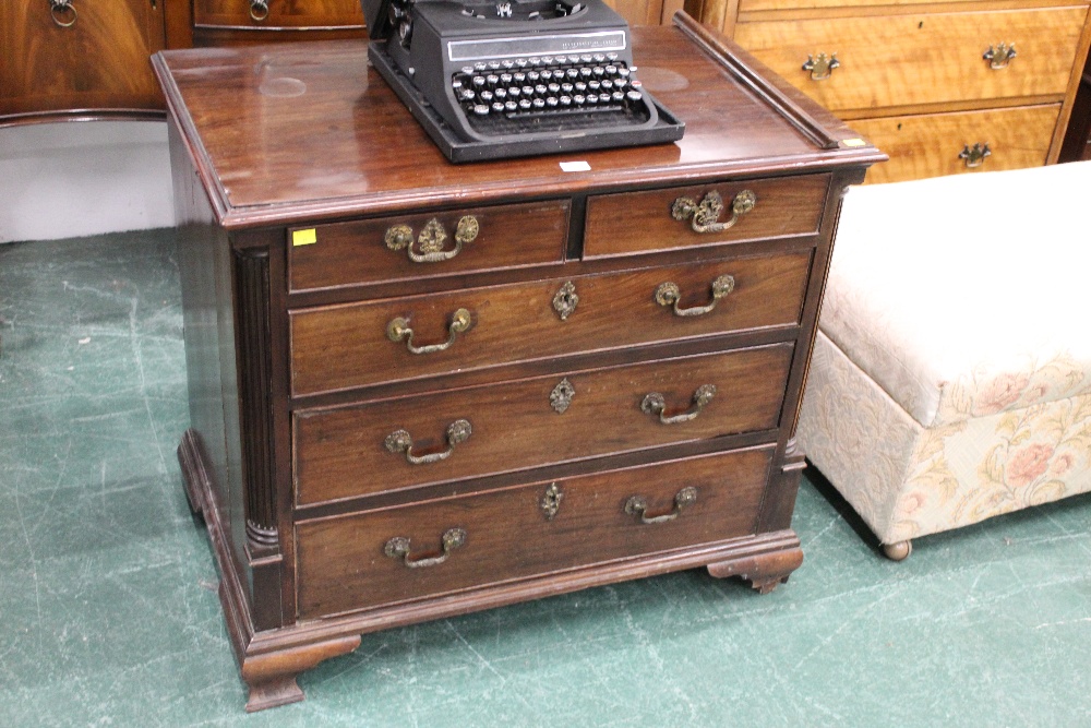 A Georgian mahogany 2/3 chest of drawers with quarter columns and raised on bracket feet,