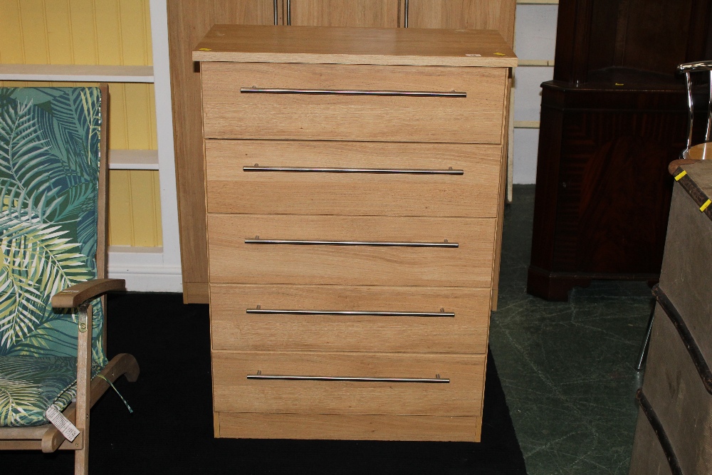 A modern wood effect 5 drawer chest of drawers with metal bar handles, measuring 108 cm tall,
