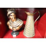 Copper coloured figural bust and a textured copper jug