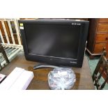 Small flat screen TV with built in DVD player and remote control