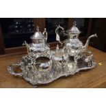 Four piece silver plated tea service on heavy gauge silver on copper tray