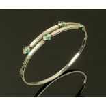 An 18 ct white gold diamond emerald set bracelet,