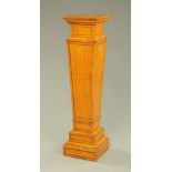 An Edwardian satinwood pedestal,