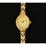 A 9 ct gold cased ladies Rotary wristwatch, with 9 ct gold bracelet. 10.4 grams gross.