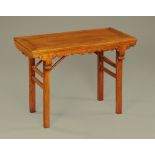 A late 19th century Chinese folding table, hardwood. Height 78 cm, width 107 cm, depth 53 cm.