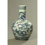 A large Chinese blue and white bottle vase, decorated with dragons. Height 61 cm.