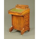 A Victorian walnut Davenport desk, with rear stationery compartment,