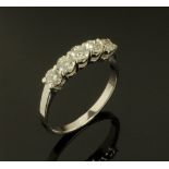An 18 ct white gold five stone diamond set ring, diamonds weighing +/- .87 carats.