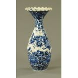 A late 19th century Chinese relief moulded dragon vase, blue and white. Height 54 cm.