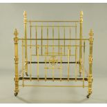 A 19th century brass bed, with bed irons. Width +/- 157 cm.