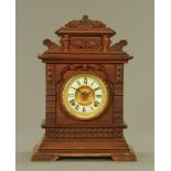 A 19th century American mantle clock, with two train striking movement by the Ansonia Clock company.