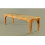 A Victorian scrubbed pine kitchen table, with cleated top on moulded square tapered legs.