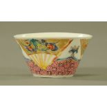 A Chinese Yong Zheng porcelain chicken cup, also decorated with fans. Diameter 6.5 cm.