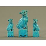 A pair of Chinese blue glaze Dogs of Fo, and another larger. Tallest 17.5 cm.