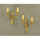 A pair of rococo style twin light sconces. Height including faux candle holders 35 cm.