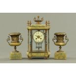 A 19th century champleve enamel and onyx clock garniture,