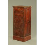 A late Victorian mahogany shutter front filing cabinet, with nine interior trays.