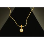 An 18 ct two tone gold rubover diamond set pendant, diamond weighing +/- .28 carats.