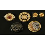 Two Victorian mourning brooches, a jet brooch, a hardstone brooch and a pair of earrings.