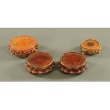 Four small Chinese wooden vase stands, comprising a pair and two others, largest diameter 10.5 cm.