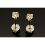 A pair of 18 ct white gold stud earrings, set with diamonds weighing +/- .45 carats.