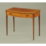An early 19th century mahogany bowfronted side table,