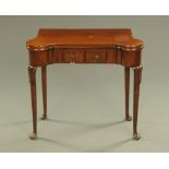 A George III mahogany turnover top games table, with counter wells and rounded corners,