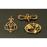 Two 9 ct gold brooches and a pendant, the brooches 1.9 grams and 1.