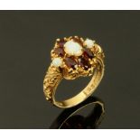 A George Jensen 9 ct gold garnet and opal ring, marked GJ Ltd to inside of band. Size N/O. 4.