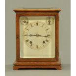 A 19th century oak cased four glass clock, with movement by Winterhalder & Hofmeier,