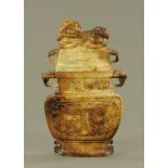 An Oriental lidded vase, soapstone. Height 42 cm, width 24 cm.