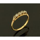 An 18 ct gold five stone diamond set ring, Size S. 2.4 grams.