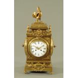 A large Victorian brass square form mantle clock,