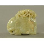 A Chinese Qianlong period jade carving, elephant with boys. Height 8 cm, length 9.5 cm.